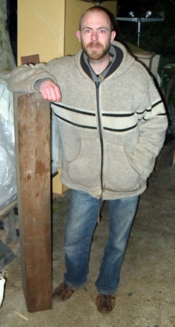 Brian with the pine roof timber he is now working with.